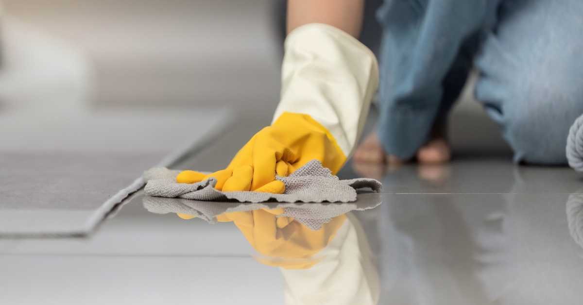 wiping dusty surface with wet cloth