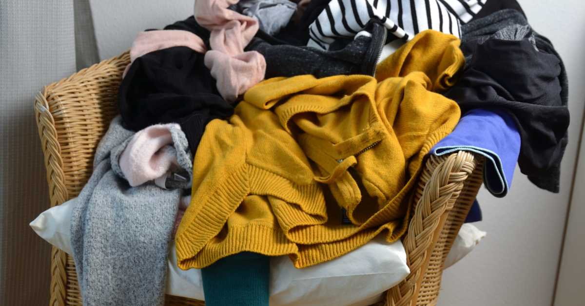 picking up clutter clothes on chair