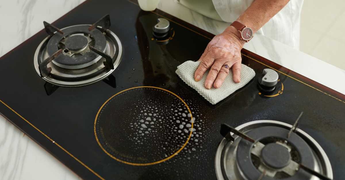 hot water cloth on greasy stove