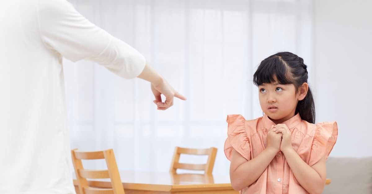 frustrated parent scolding child at home chores
