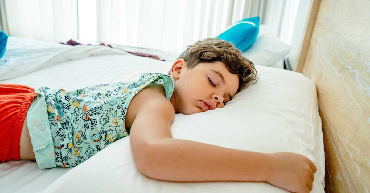 young child on bed at home