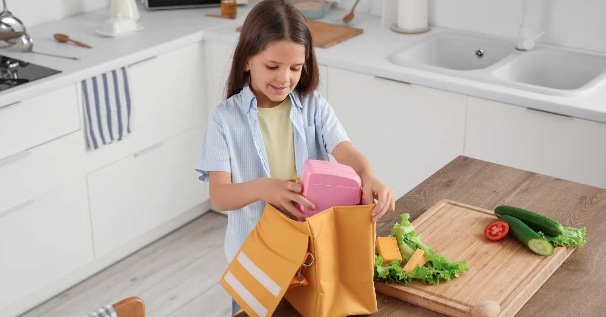child going to wash own lunch box 
